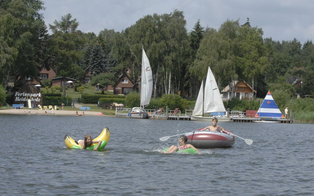 Bathing beach with sand in a bottle and fun on the water, © Timo Weisbrich