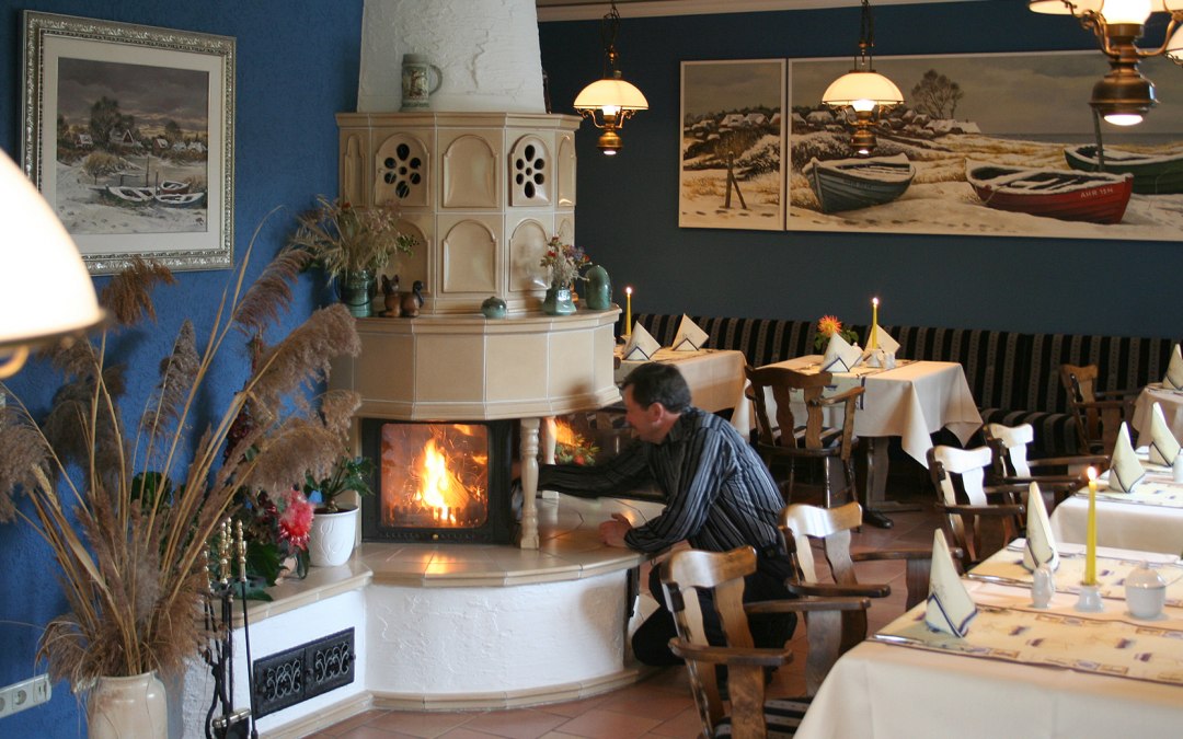 Cozy hours by the fireplace enchant at the end of a cold winter day, © Robert Niche
