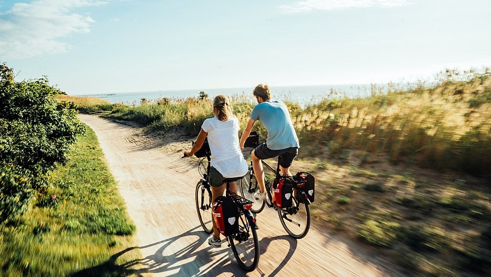 A couple cycling along the cliffs near the Baltic seaside resort of Wustrow Fischland-Darß-Zingst