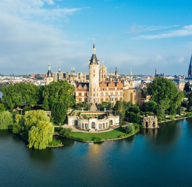 Schwerin Castle - its splendor still shines beyond the green expanses of its worth seeing parks, © TMV/Allrich